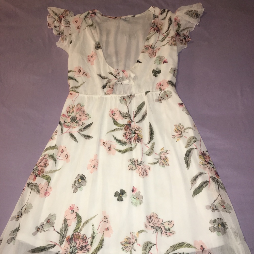 A MAXI DRESS WITH FLOWER DETAILS